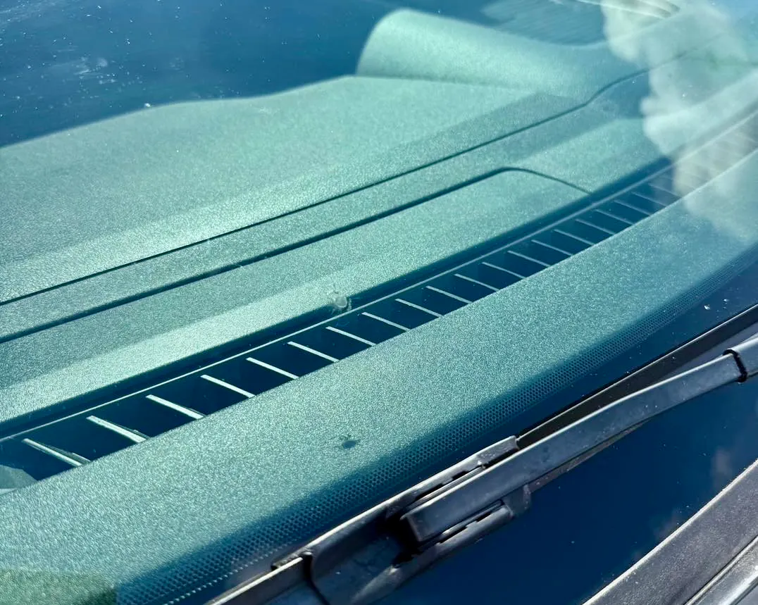 Close-up of a windshield above the wiper cowl
