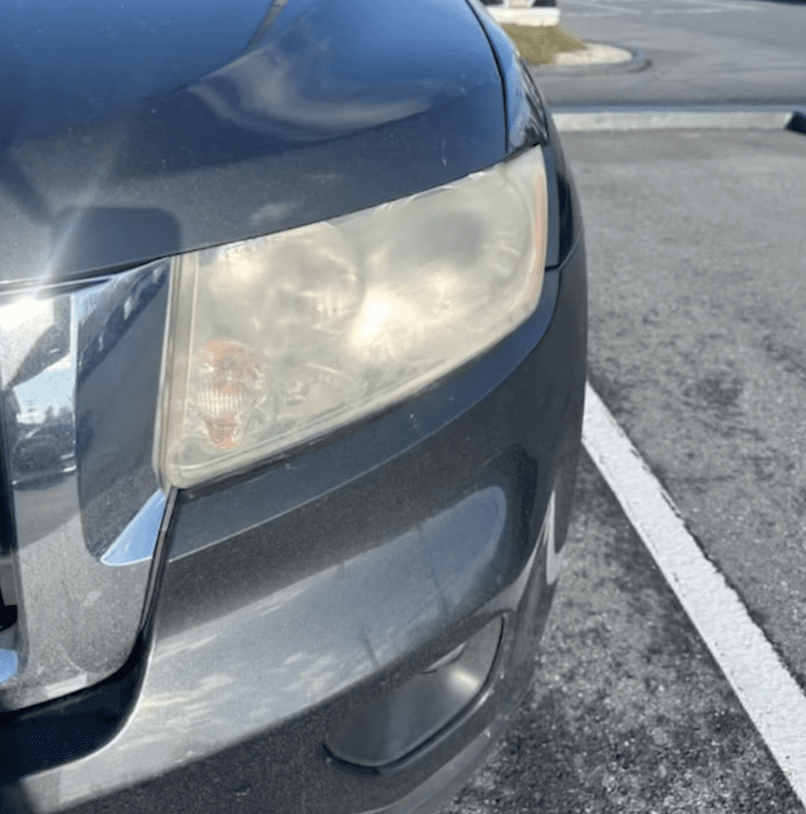 Damaged vinyl panel before body shop sublet repair