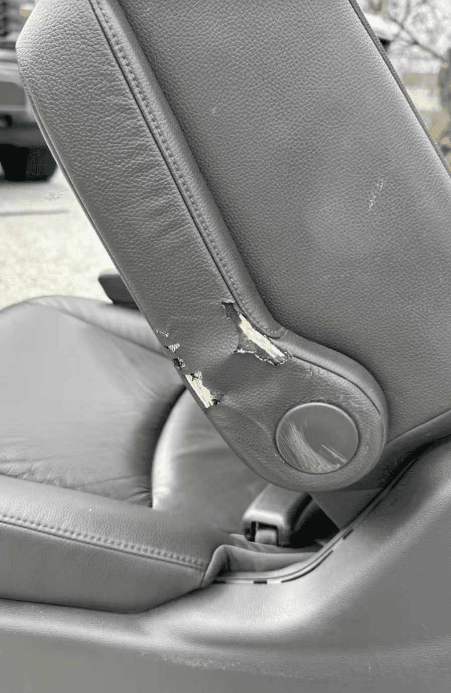 Worn leather bolster before fleet interior reconditioning