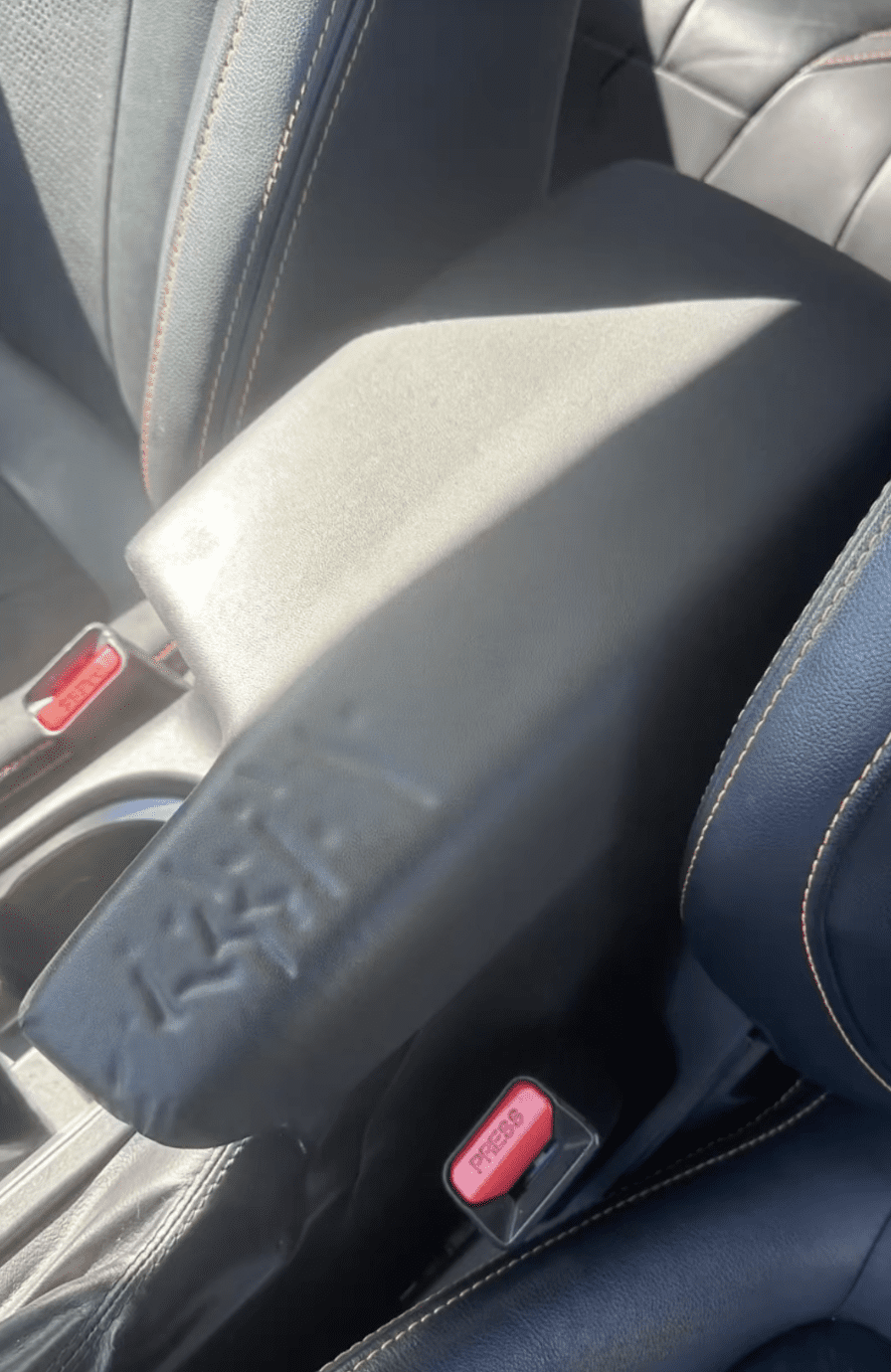 Worn upholstery before fleet vehicle interior service
