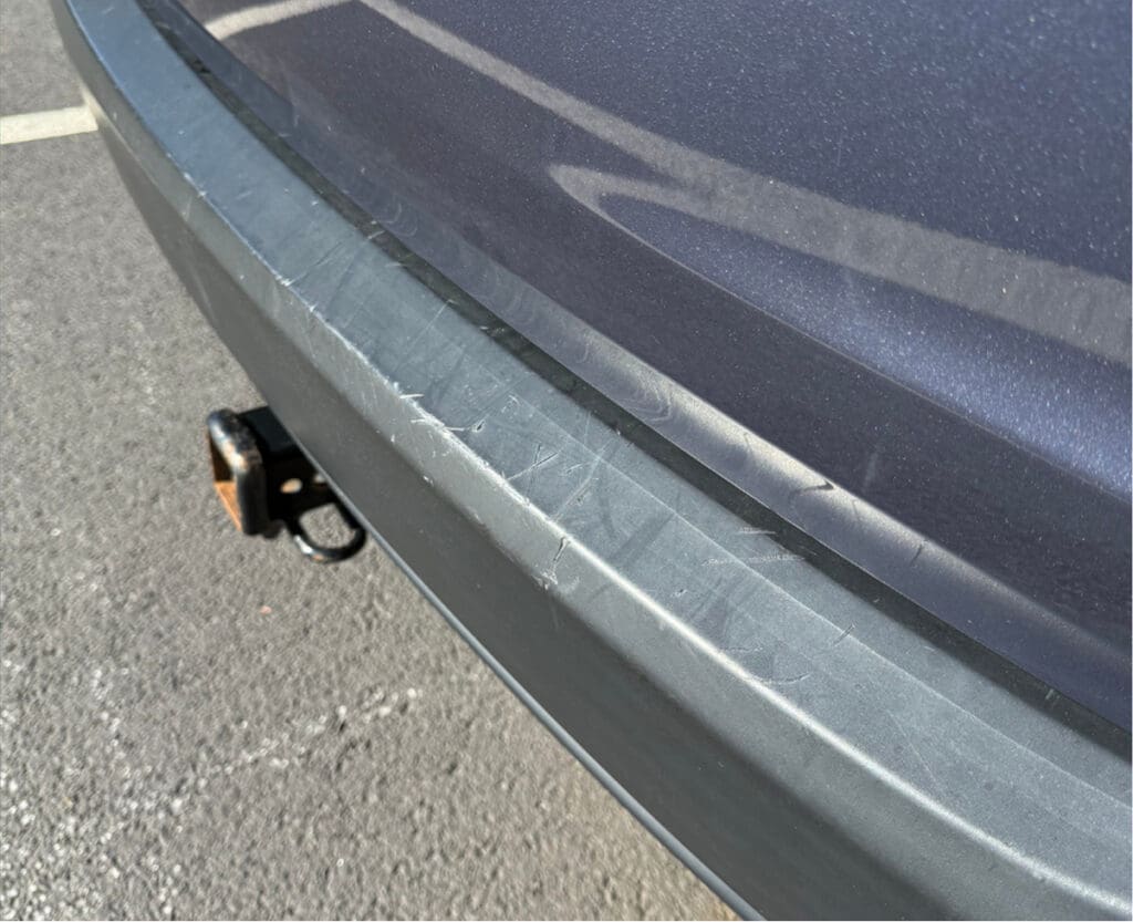 Torn vehicle seat before insurance claim repair