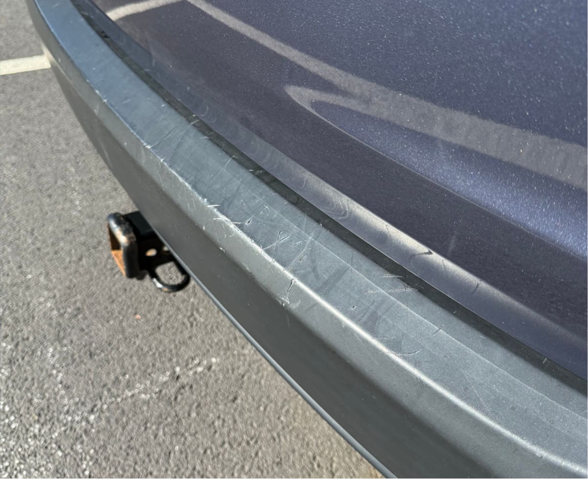 Torn vehicle seat before insurance claim repair