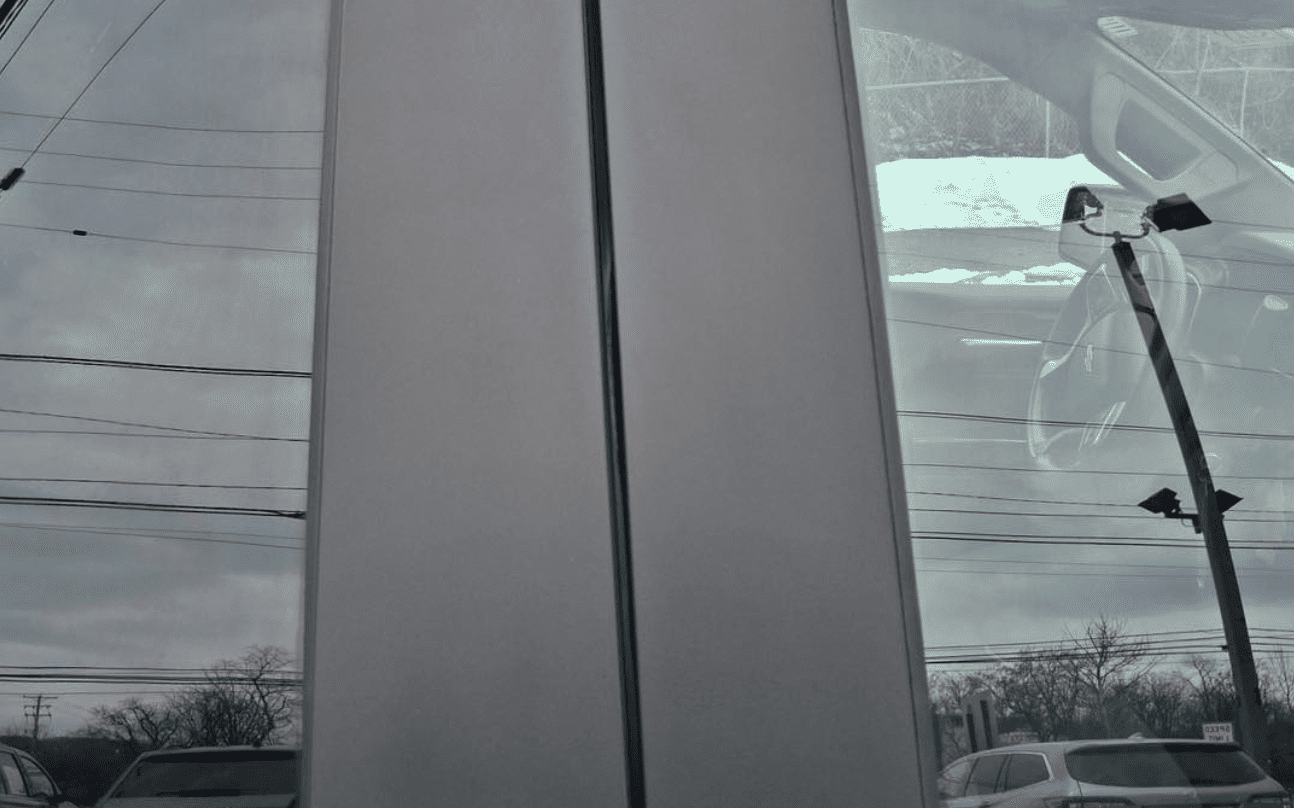 Restored door panel by mobile dealership reconditioning technician