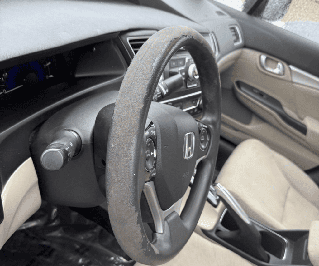 Worn car interior before interior detailing in Allentown PA