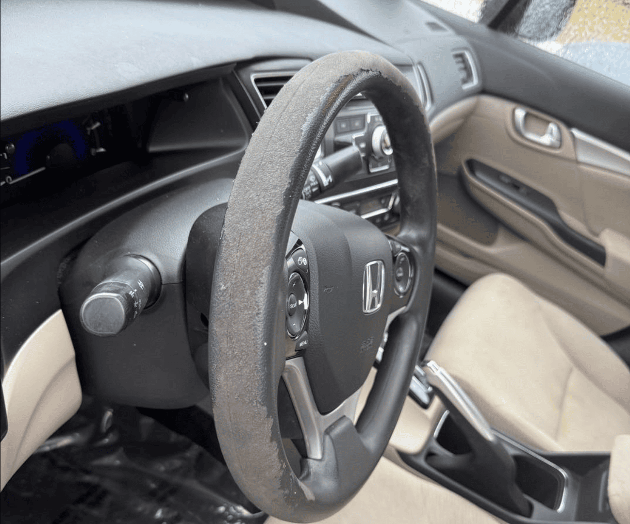 Worn car interior before interior detailing in Allentown PA