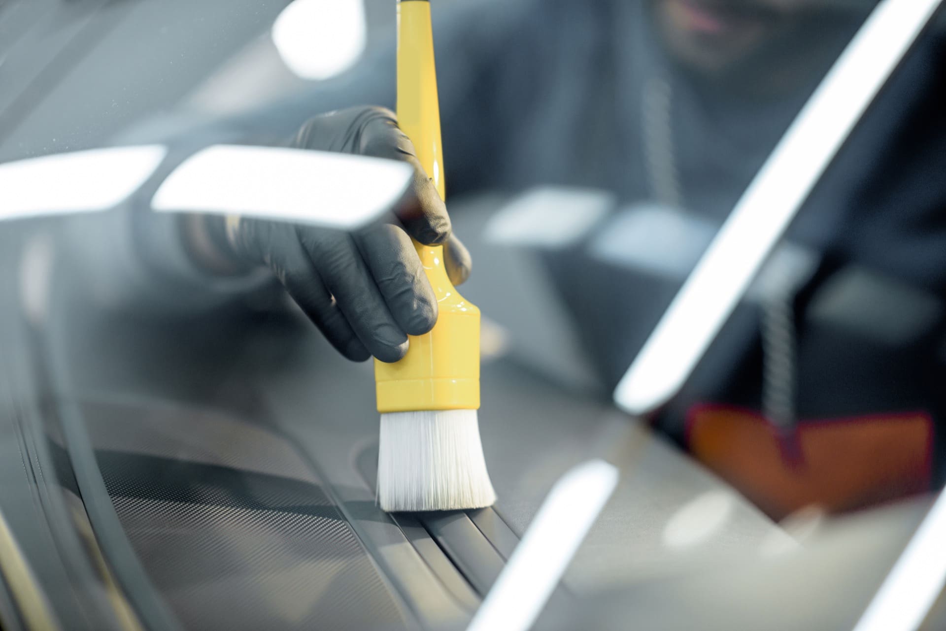 Mobile car detailing technician deep cleaning a vehicle interior in Allentown PA