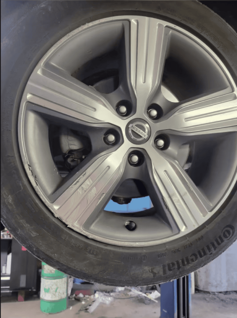 Alloy wheel curb rash before rim repair in York PA