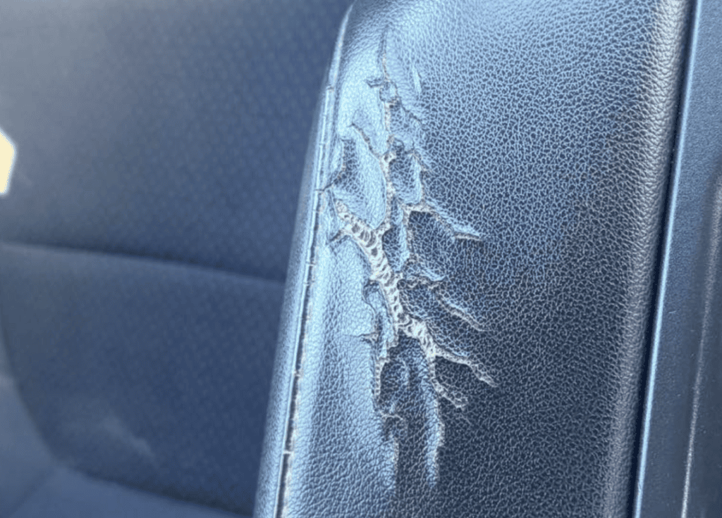 Cracked vinyl car upholstery before auto upholstery repair in York PA
