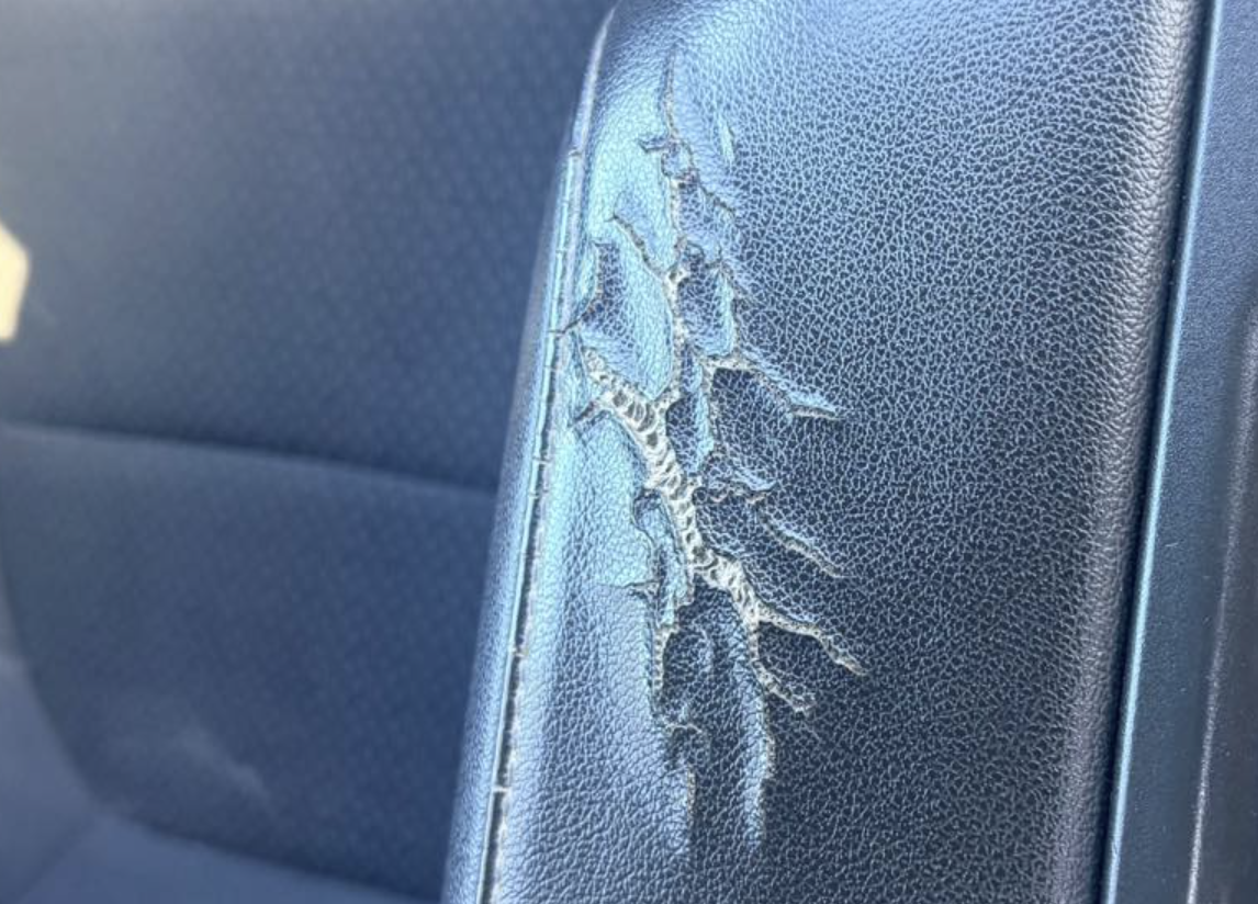 Cracked vinyl car upholstery before auto upholstery repair in York PA
