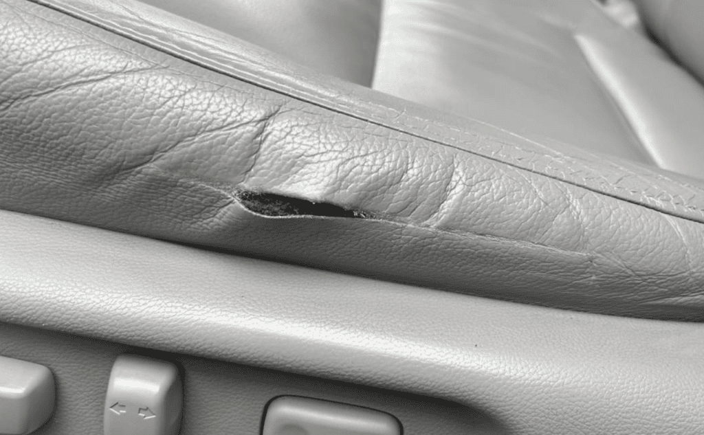 Torn leather car seat before leather repair in York PA